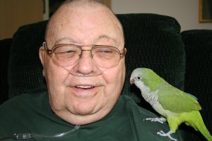 pet therapy bird making visit to hospice pt.